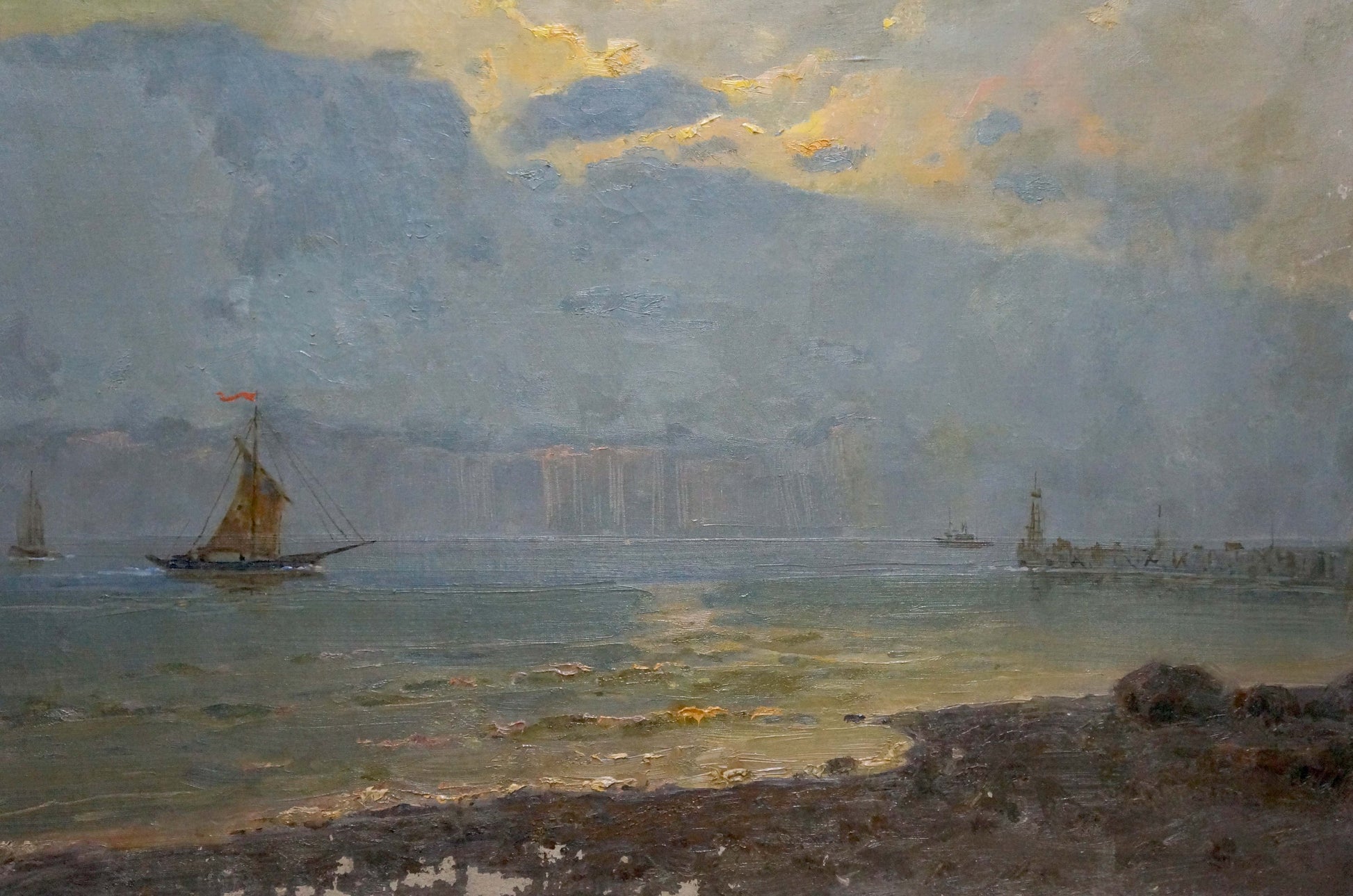 Sailing vessels captured on a still sea in an oil painting, the artist's identity undisclosed